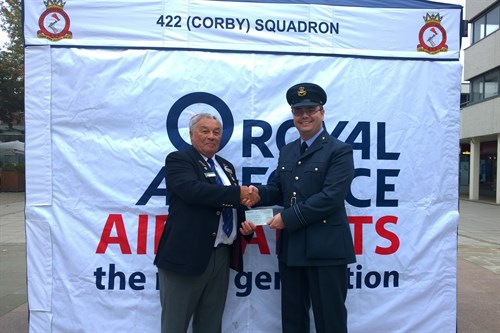 Corby Air Cadets Commanding Officer presents at cheque to the Corby RAFA Branch