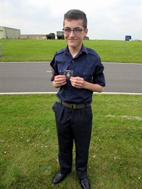 Cdt Curry J with his award for his outstanding work
